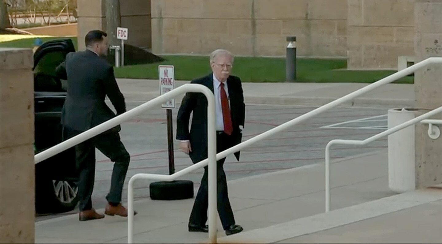 John Bolton surrenders to face charges of sharing classified information