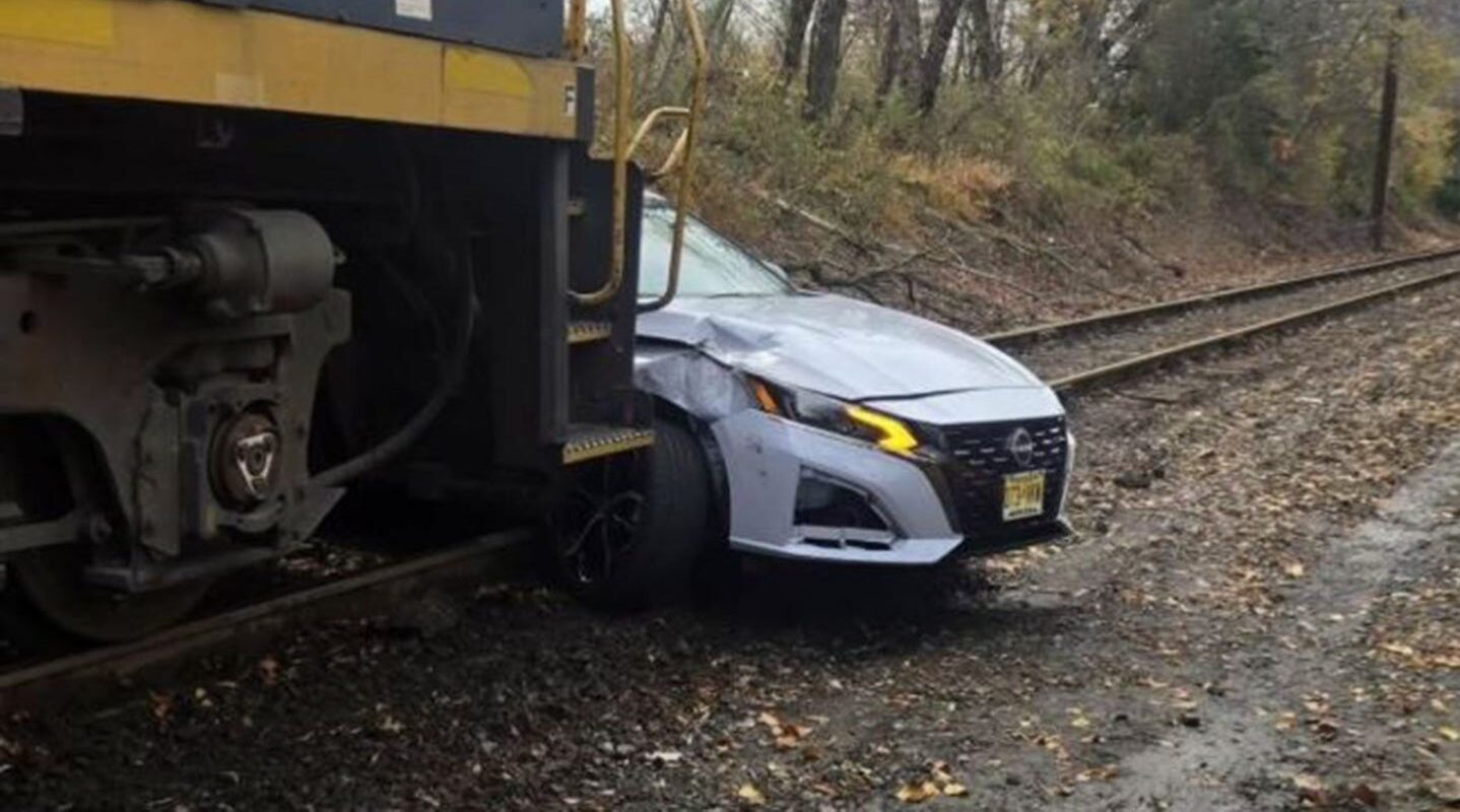 Train pushes car quarter-mile on tracks as 82-year-old driver suffers minor injuries